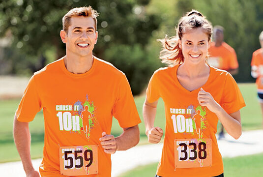 man and woman running 10k