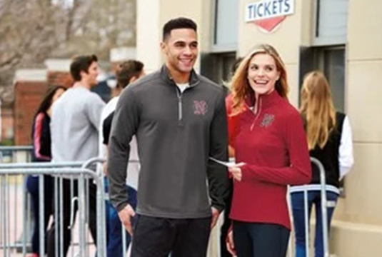 man and woman outside waiting for tickets