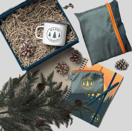 holiday gift set with camper mug, foldable duffel, notebook and pen